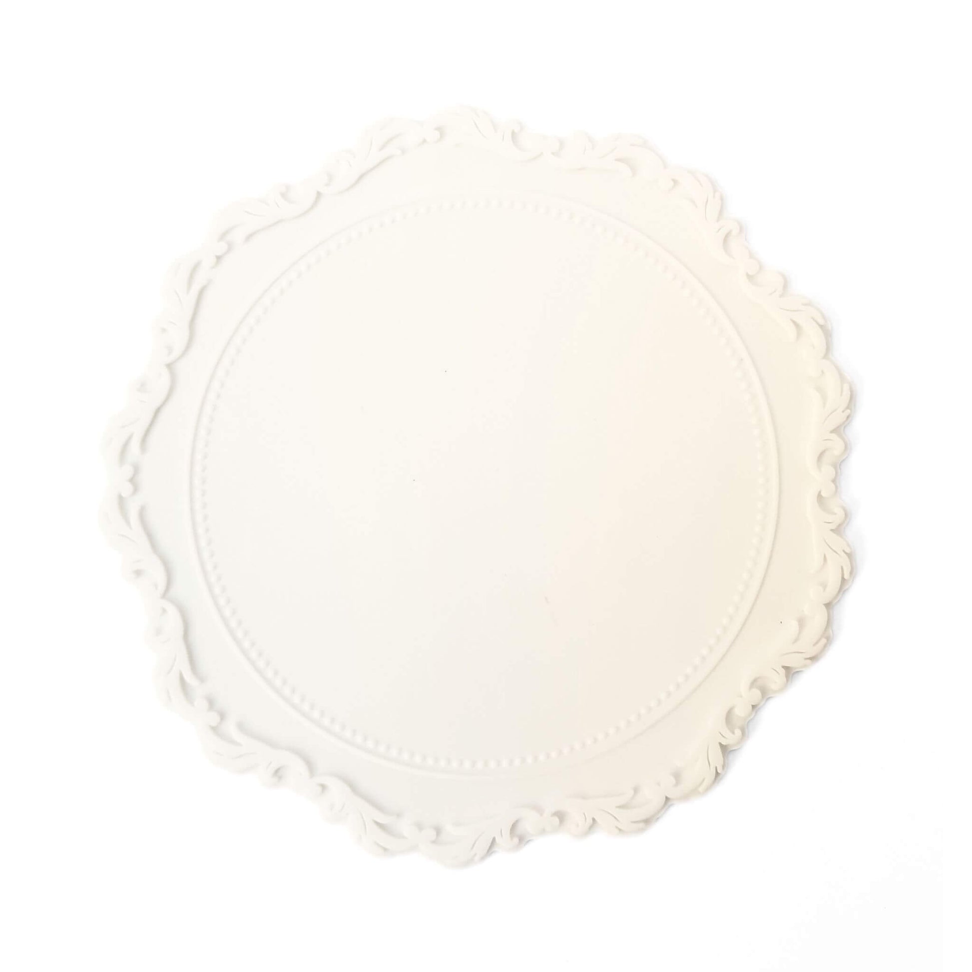 white round wax sealing mat with rococo style detail on border
