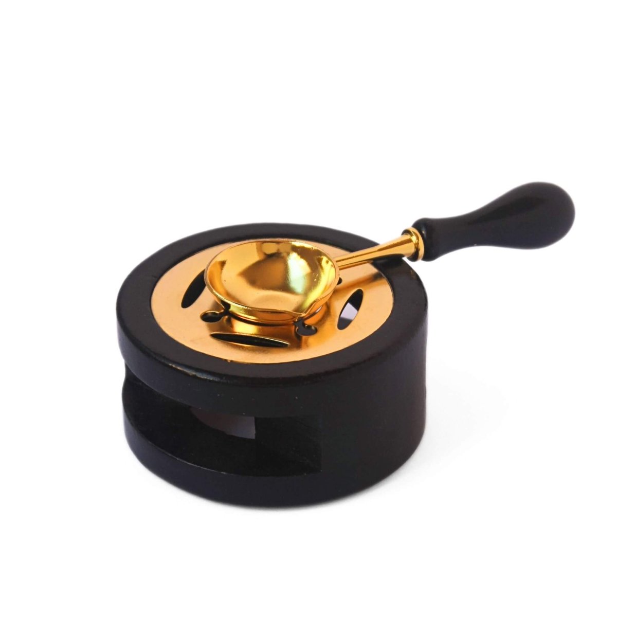 black and gold wax melting stove and spoon