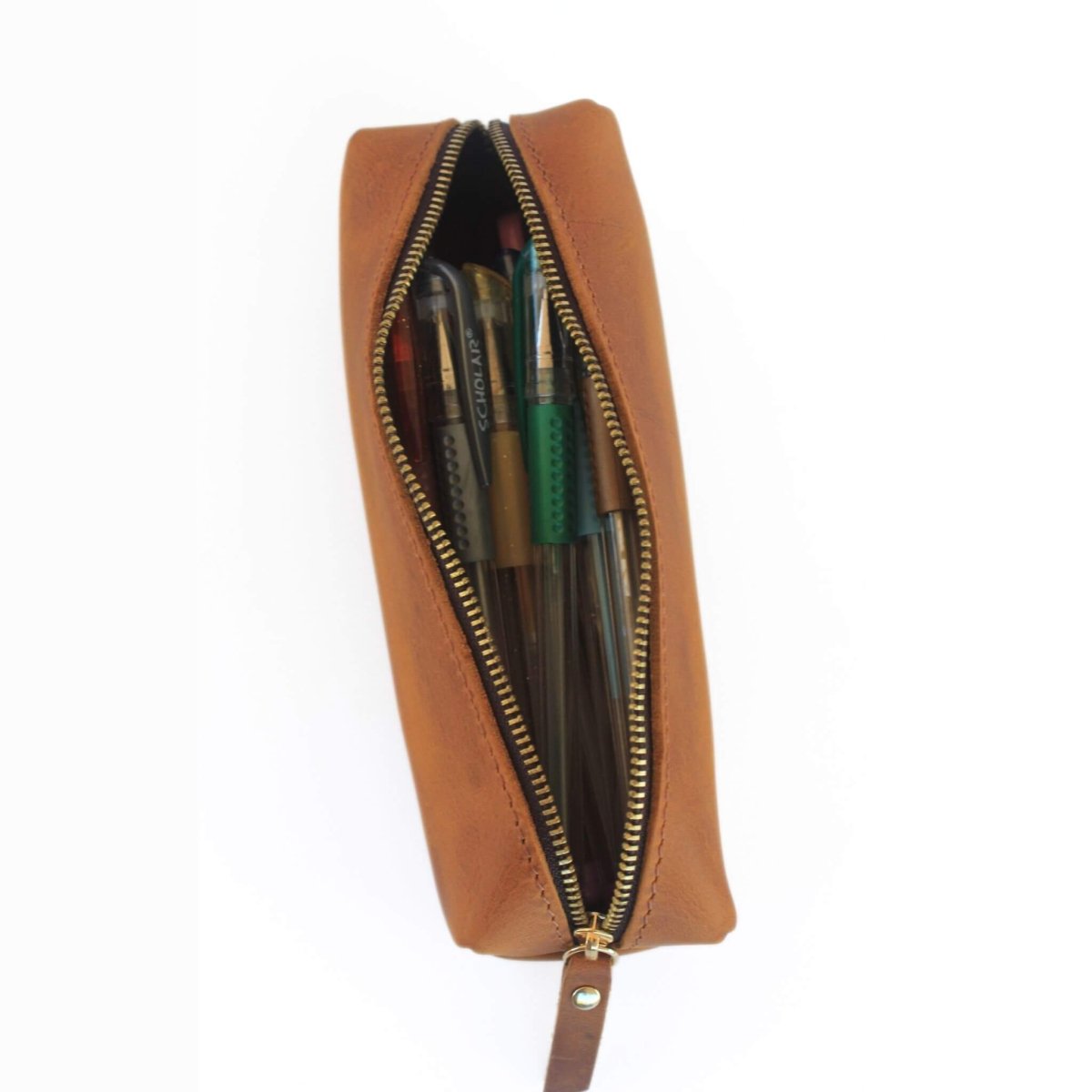 open brown leather pencil case with pens inside
