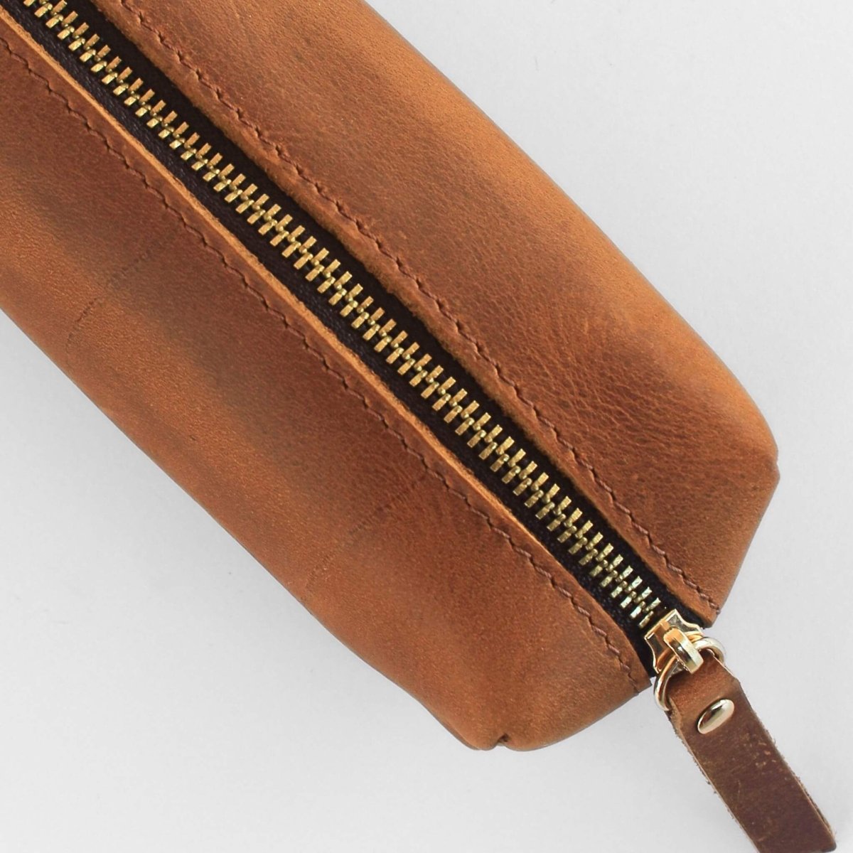 close up of small box style leather pencil case