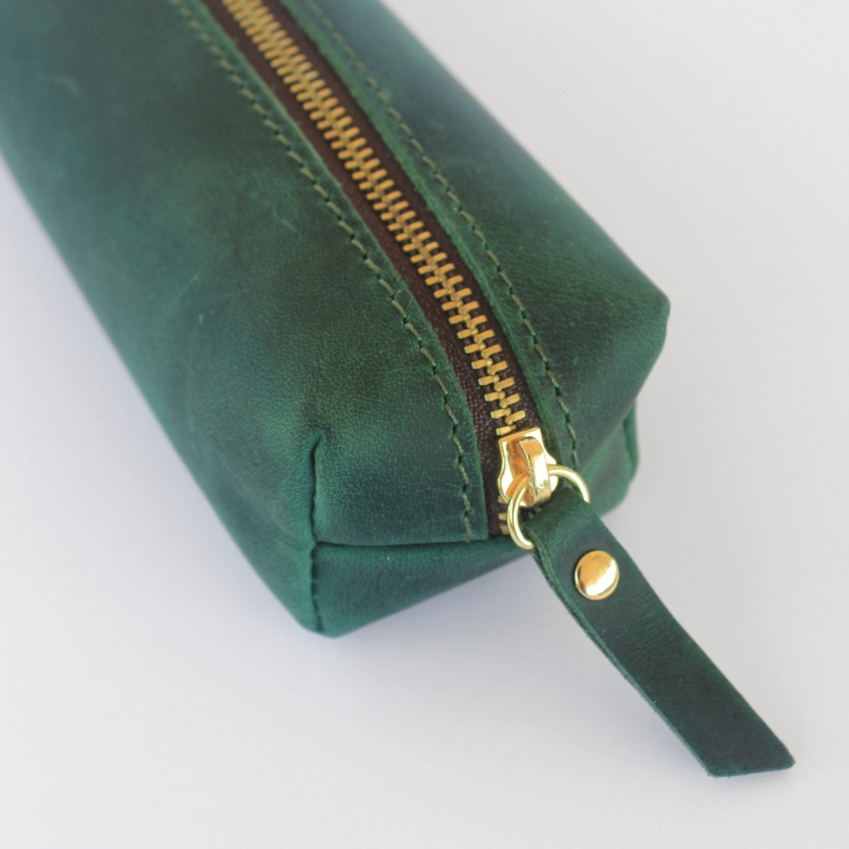 green genuine leather pencil case close up of zip