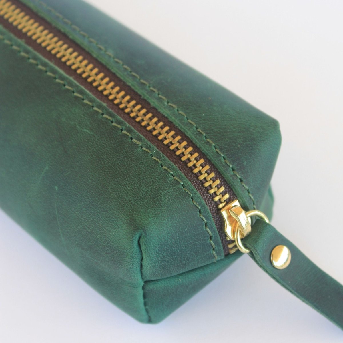 close up of green leather box style pen case
