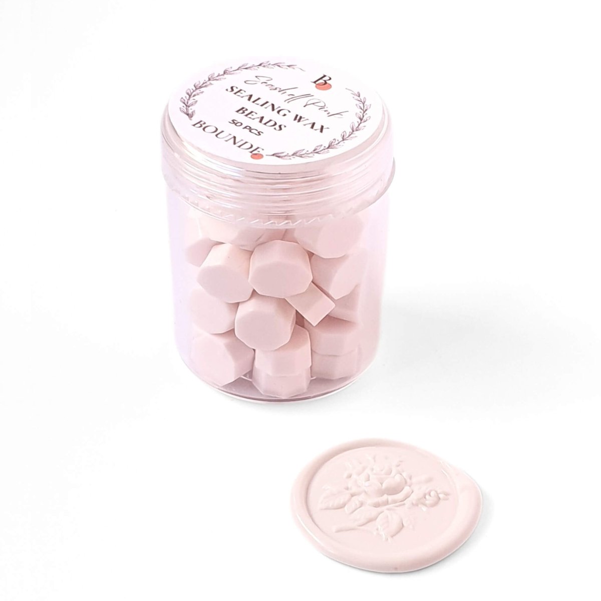 light pink wax seal beads in jar